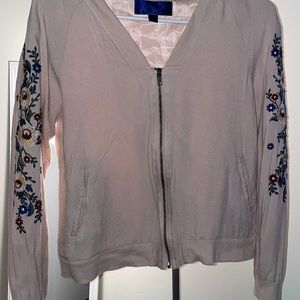 small pink zip up with flower sleeves